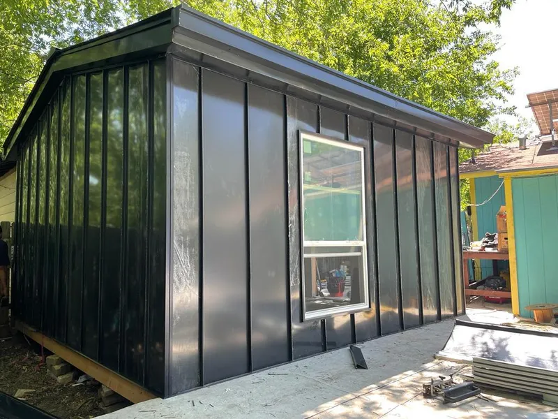 Black standing seam metal wall panels for Roof Inspection in Hunters Creek