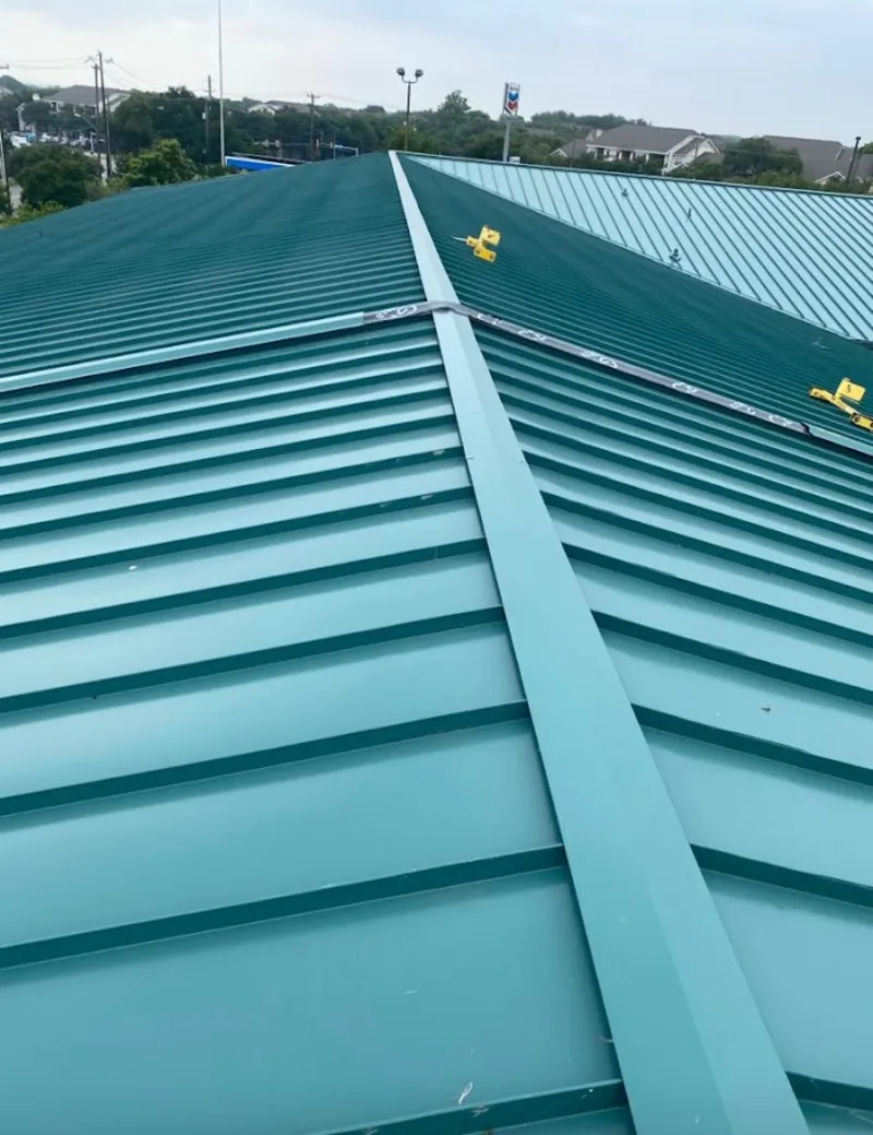 Green commercial metal roof ridge and valley for Metal Roof Repair in Hunters Creek